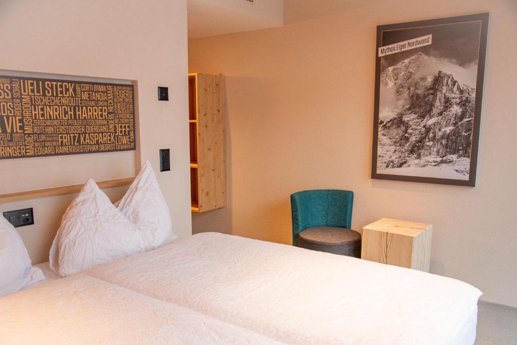 Postel nebo postele na pokoji v ubytování Eiger Lodge Chic
