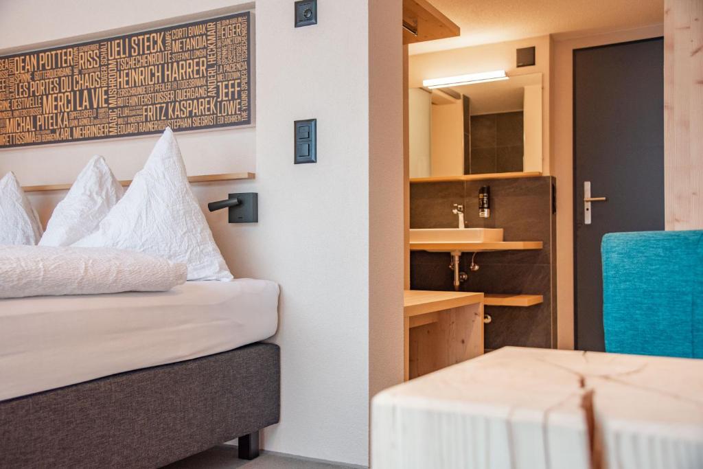 Postel nebo postele na pokoji v ubytování Eiger Lodge Chic
