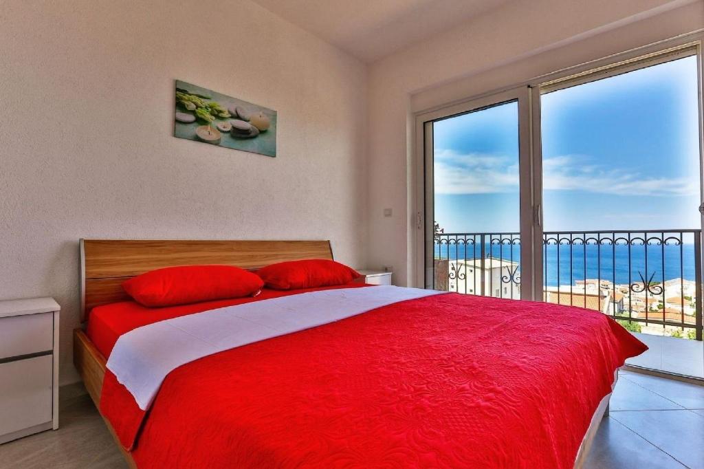 Postel nebo postele na pokoji v ubytování MarBok Apartments with SeaView