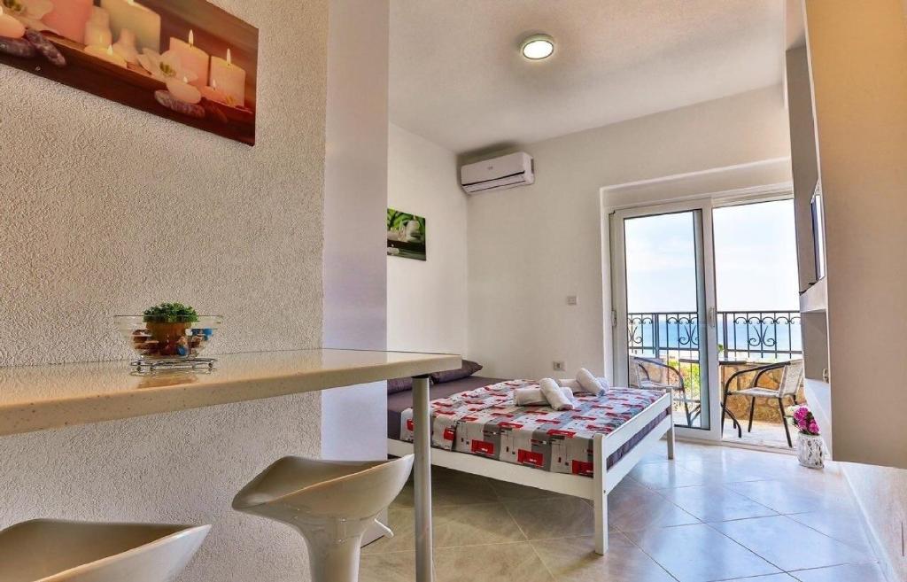 Postel nebo postele na pokoji v ubytování MarBok Apartments with SeaView
