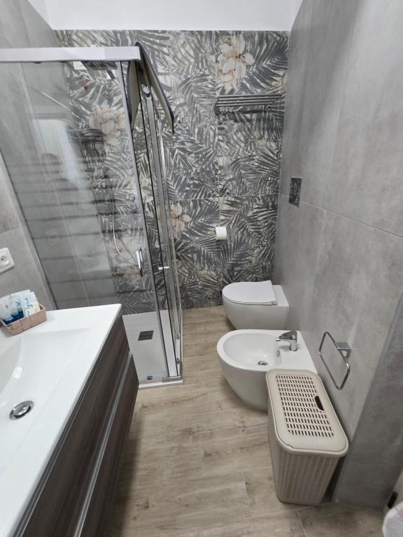 a bathroom with a toilet and a sink and a shower at Perla -Centro Storico Vasto- in Vasto