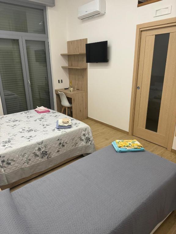 Postel nebo postele na pokoji v ubytování B&B Stella Irpina
