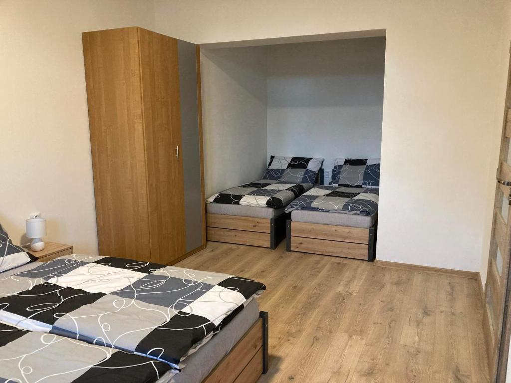 Postel nebo postele na pokoji v ubytování Apartmány Sport