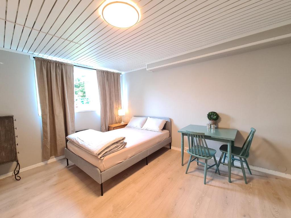 En eller flere senger på et rom på DT Serene Villa - Lillestrøm