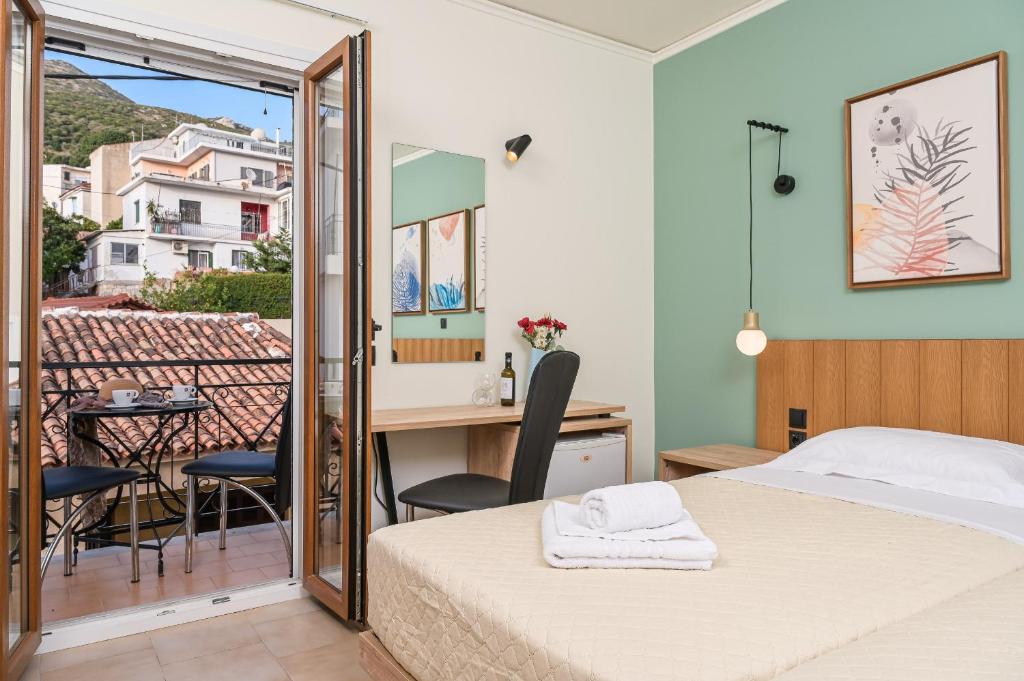 A bed or beds in a room at Emily Hotel