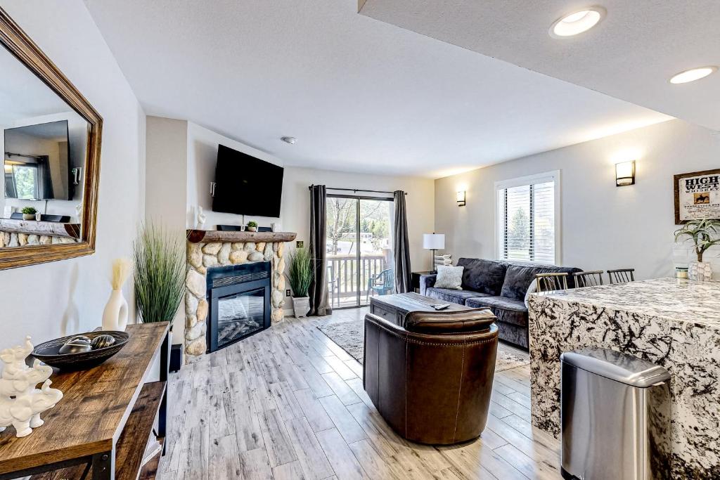 a living room with a couch and a fireplace at Elegant Escape in Park City