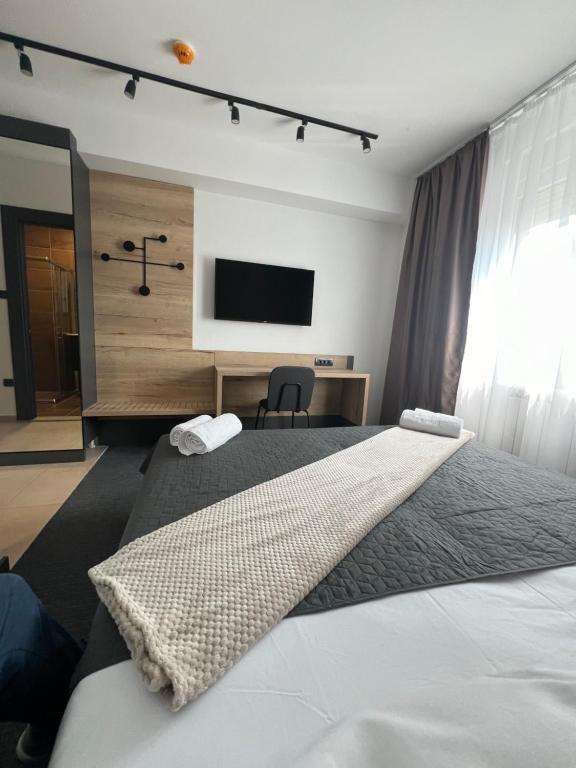 Posteľ alebo postele v izbe v ubytovaní Sremsky inn