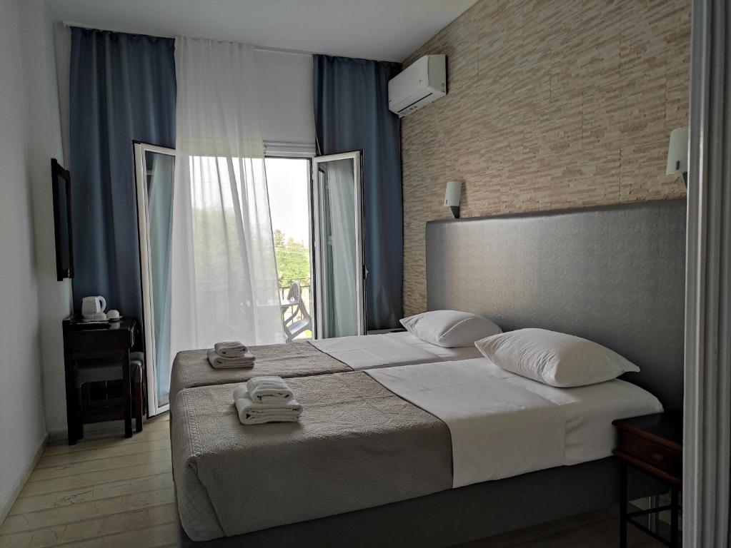 Letto o letti in una camera di Tina Hotel