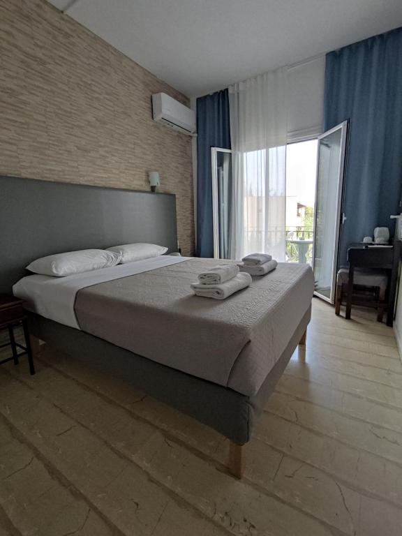 Letto o letti in una camera di Tina Hotel