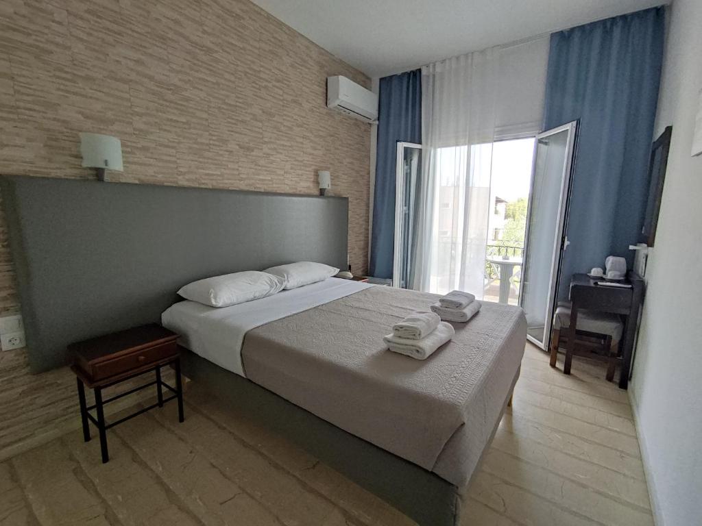 Letto o letti in una camera di Tina Hotel