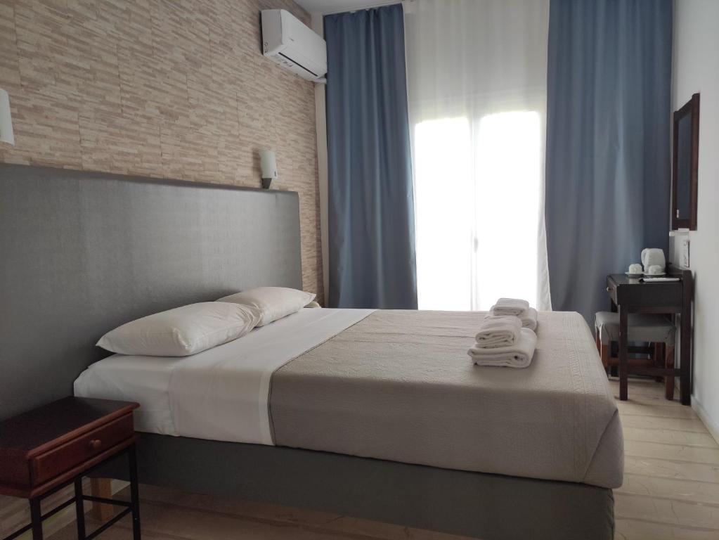 Letto o letti in una camera di Tina Hotel