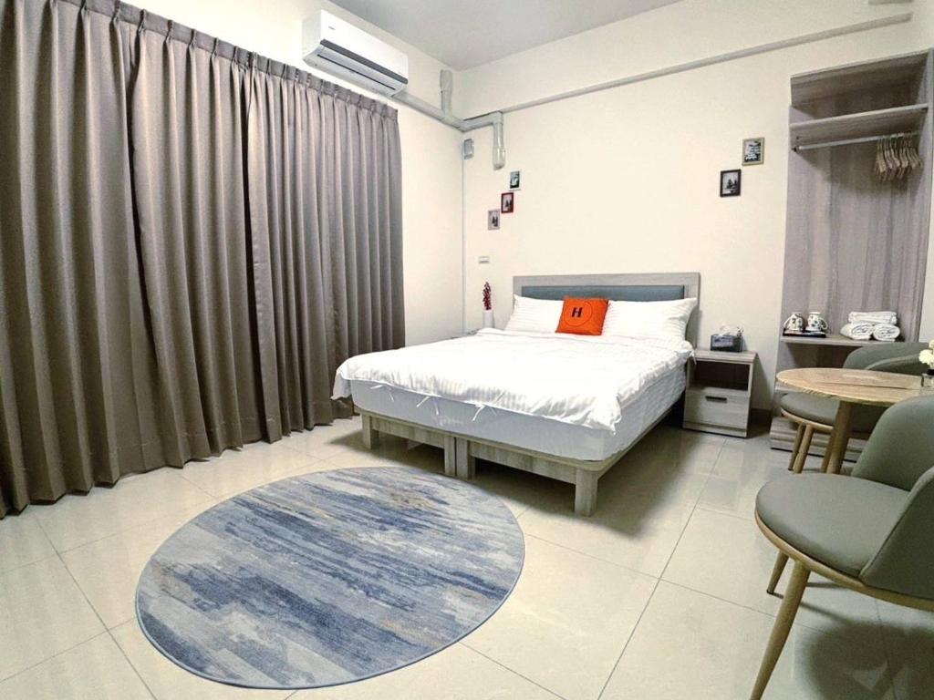 Postel nebo postele na pokoji v ubytování Ling Lai B&B