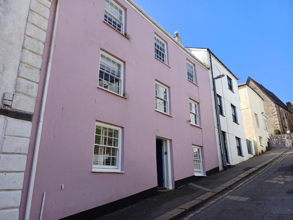 a pink house on a street in worcestershire at Palomar in Falmouth