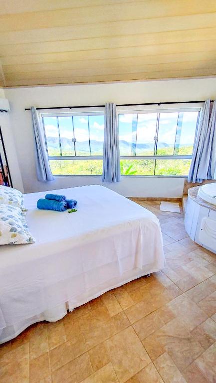 Postel nebo postele na pokoji v ubytování Bangalô São Jorge - Ecohospedagem Canto da Coruja