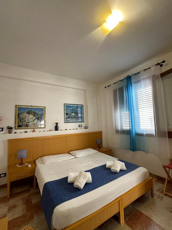 Postel nebo postele na pokoji v ubytování Isoladelmiele