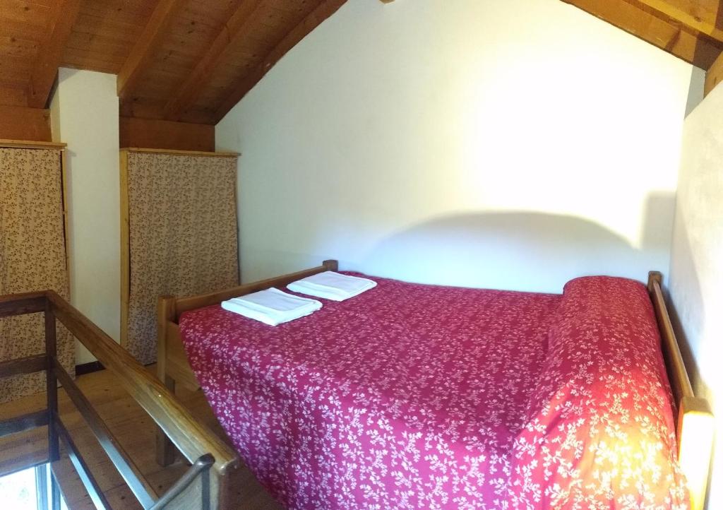 Łóżko lub łóżka w pokoju w obiekcie Agriturismo La Fonte Di Mariella