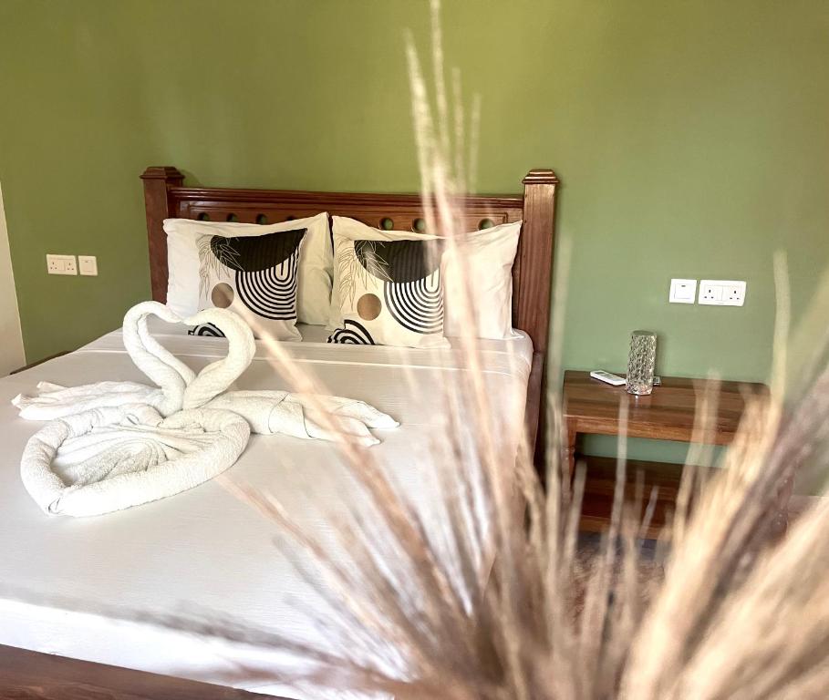 Postel nebo postele na pokoji v ubytování CeZeRe THE PALM HOTEL