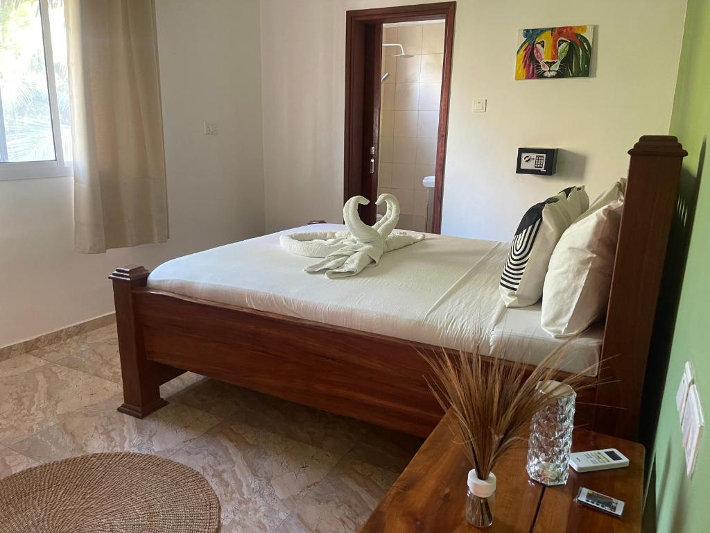Postel nebo postele na pokoji v ubytování CeZeRe THE PALM HOTEL