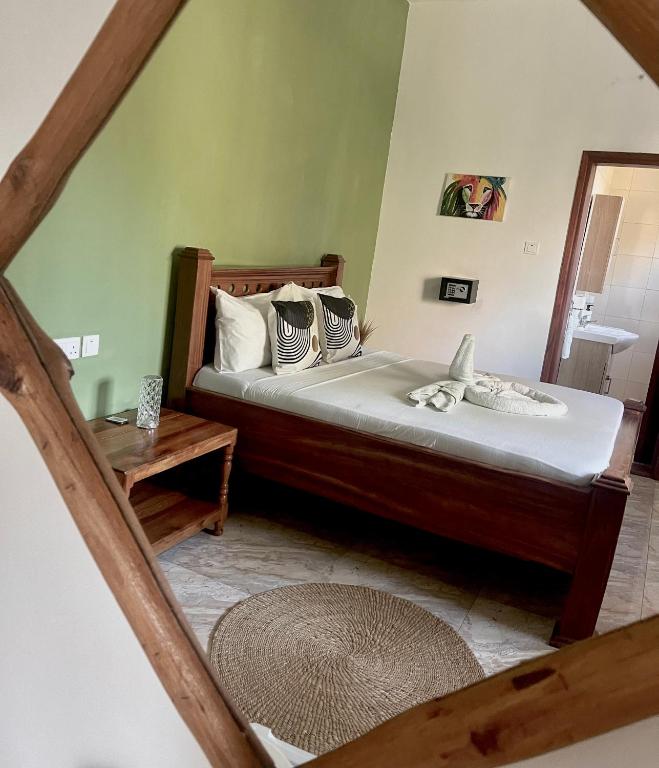 Postel nebo postele na pokoji v ubytování CeZeRe THE PALM HOTEL