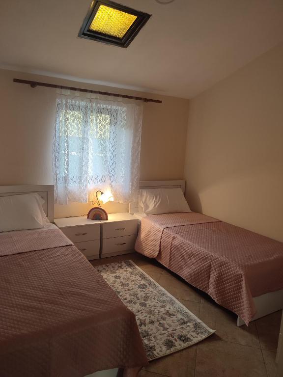 Postel nebo postele na pokoji v ubytování Rooms Xani
