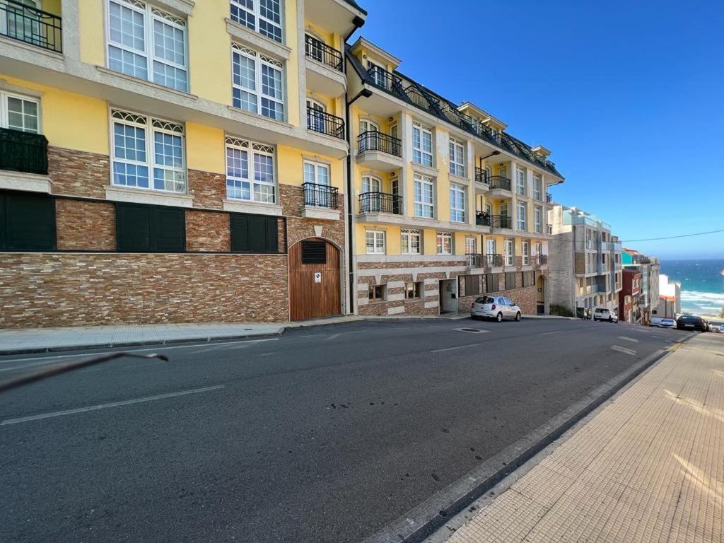 an empty street in front of a large building at Öspede Lara Malpica de Bergantiños-Costa da Morte in Malpica
