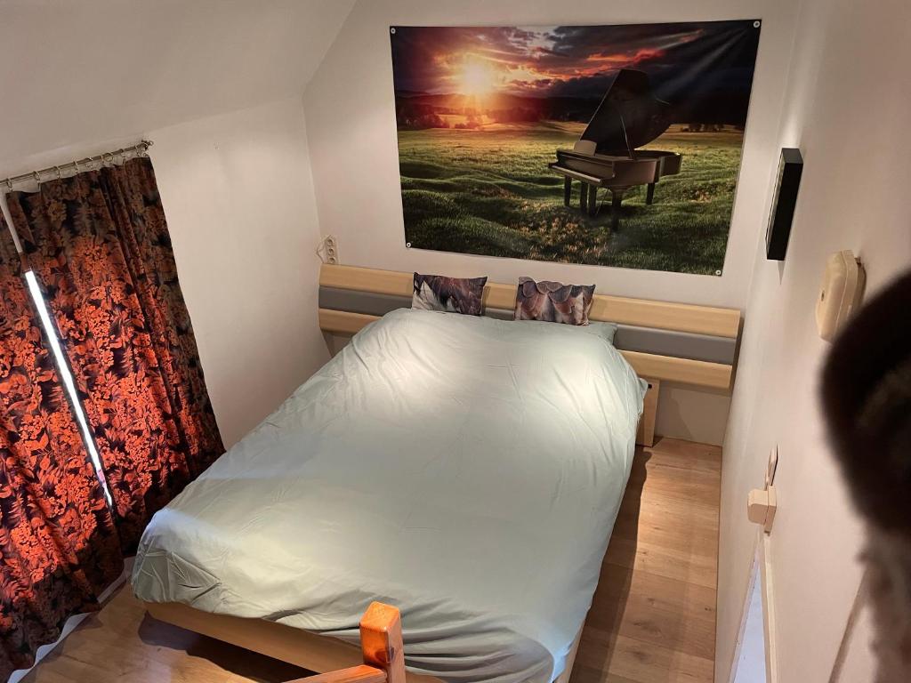 Postel nebo postele na pokoji v ubytování 't Mozarthuys