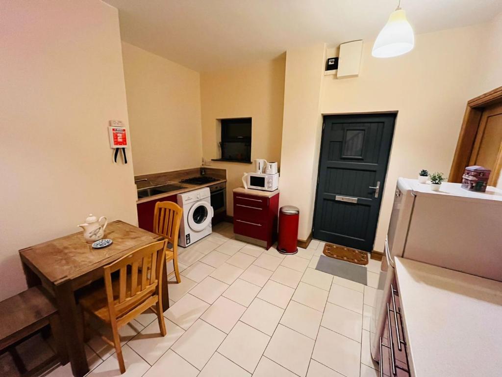 Kuchyň nebo kuchyňský kout v ubytování Dormitorio Doble D08