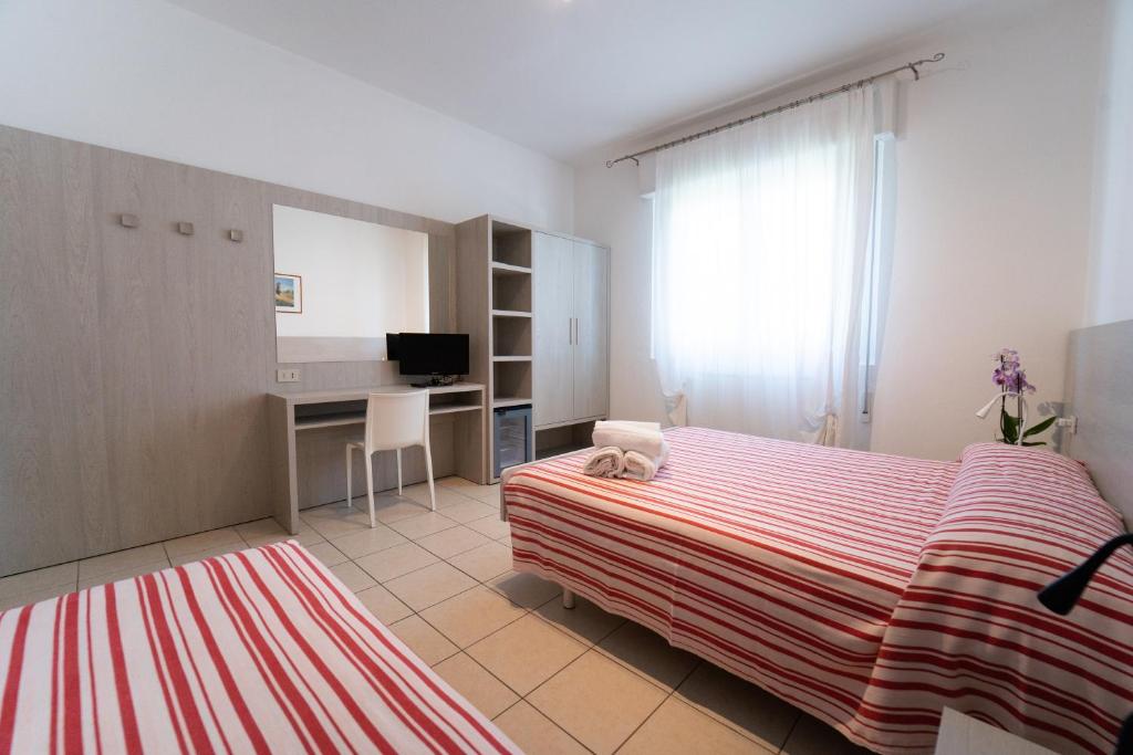 Postel nebo postele na pokoji v ubytování Hotel Dafne