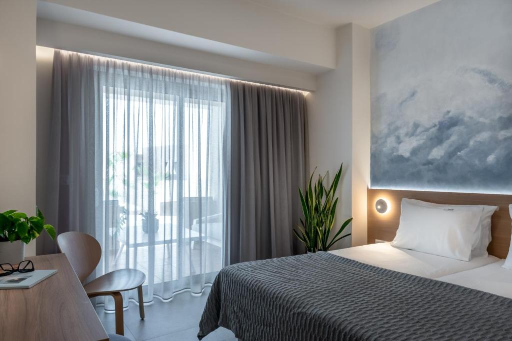 Postel nebo postele na pokoji v ubytování Blue Dome Hotel