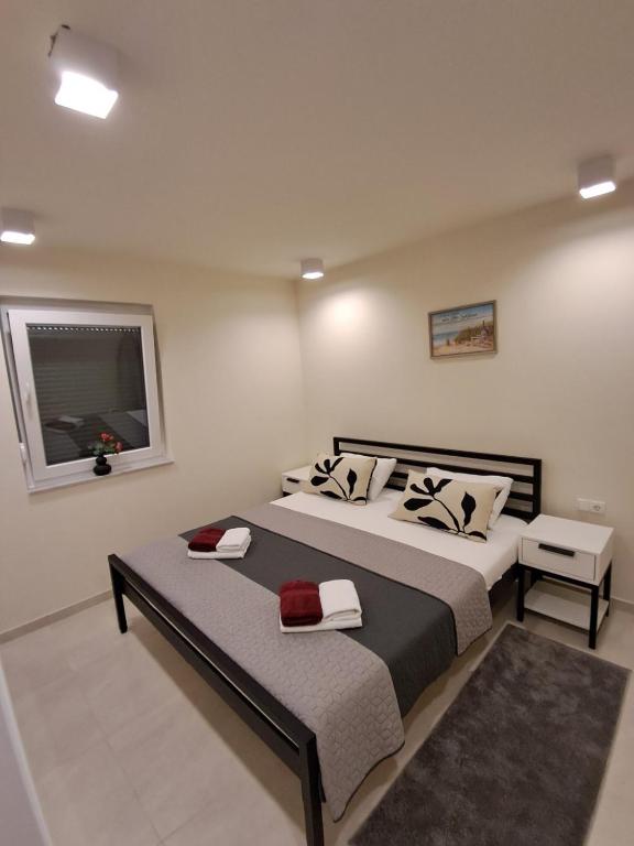 Postel nebo postele na pokoji v ubytování Apartmani Datea