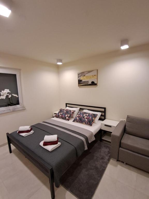 Postel nebo postele na pokoji v ubytování Apartmani Datea