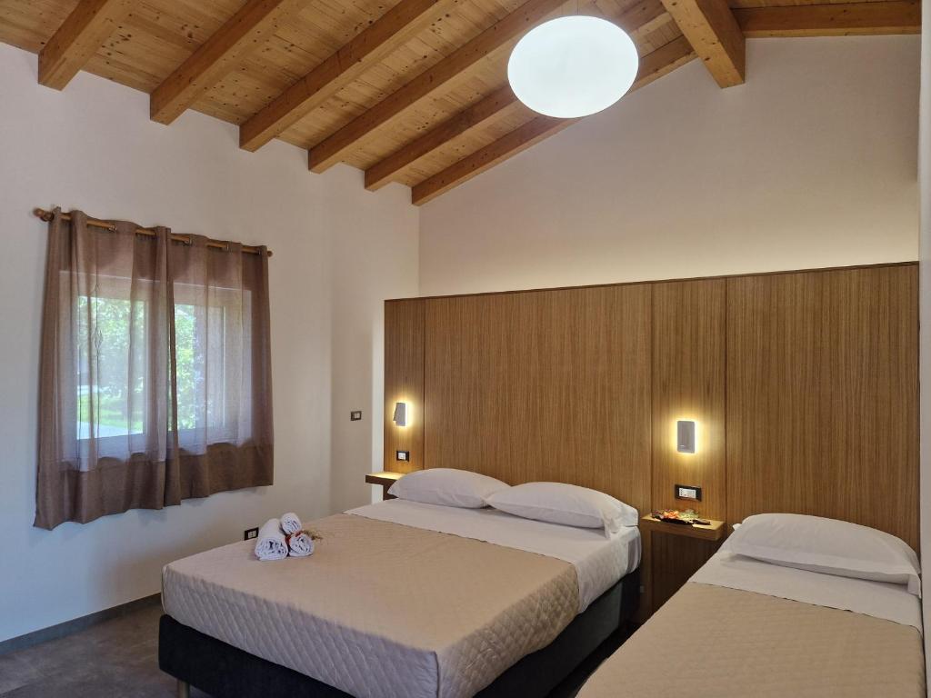 Postel nebo postele na pokoji v ubytování Agriturismo Lumia Resort