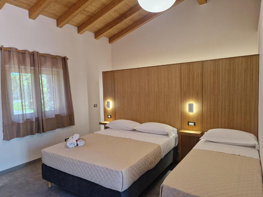 Postel nebo postele na pokoji v ubytování Agriturismo Lumia Resort