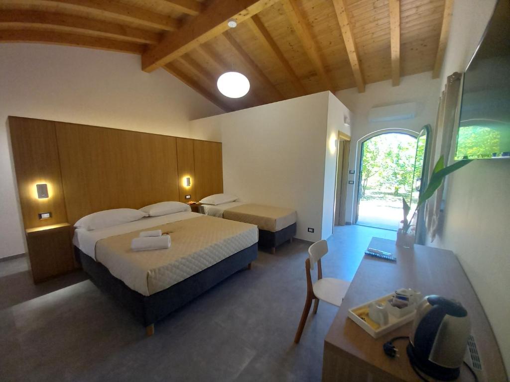 Postel nebo postele na pokoji v ubytování Agriturismo Lumia Resort