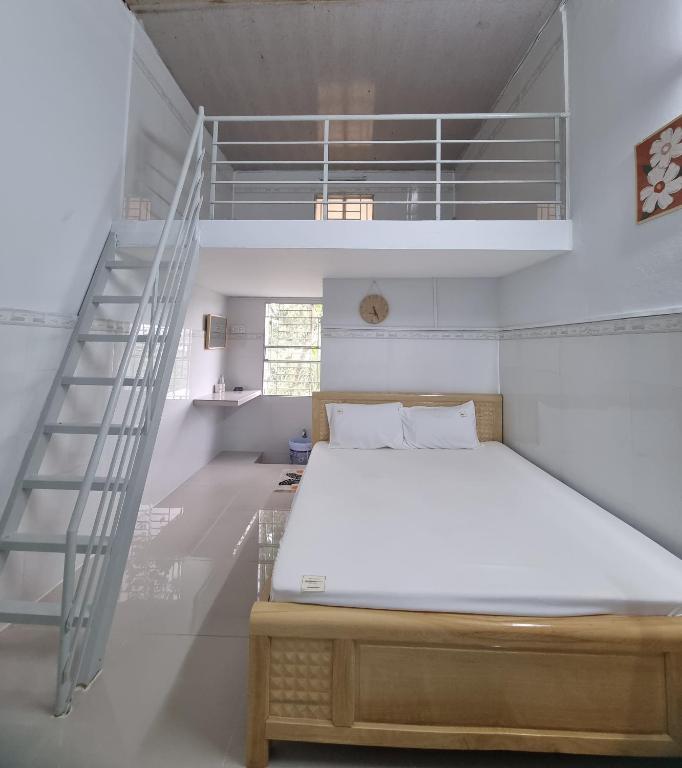 Postel nebo postele na pokoji v ubytování Tran Phu Riverside House