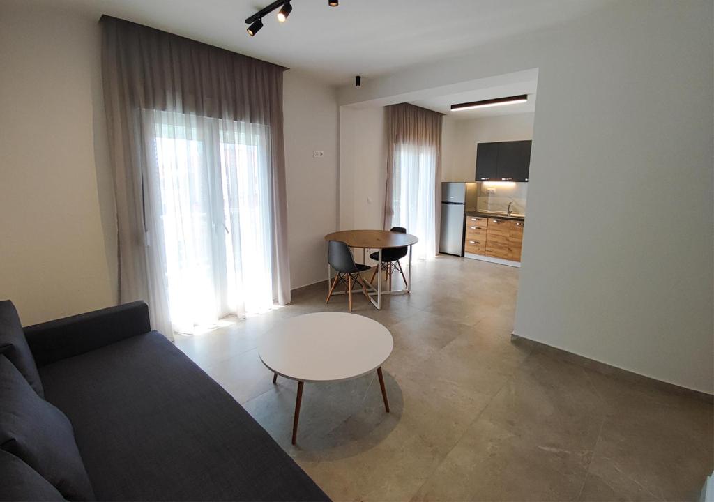 a living room with a couch and a table at K78 Studios A2 in Nea Michaniona