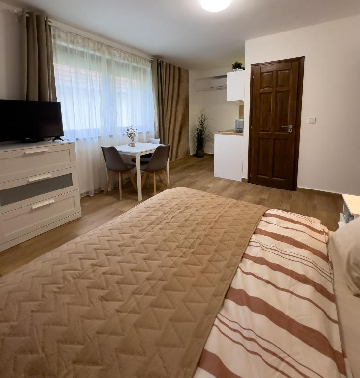 Postel nebo postele na pokoji v ubytování RP Apartmanház