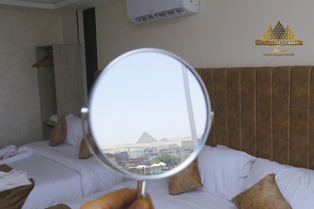 Letto o letti in una camera di Horizon Pyramids View inn