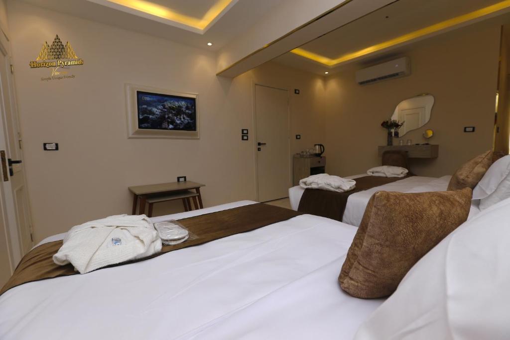 Letto o letti in una camera di Horizon Pyramids View inn