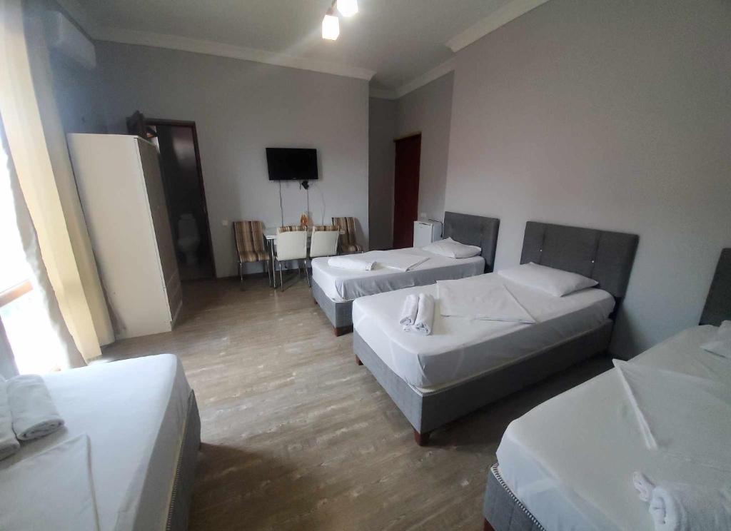 Rúm í herbergi á Elite Hotel Kobuleti