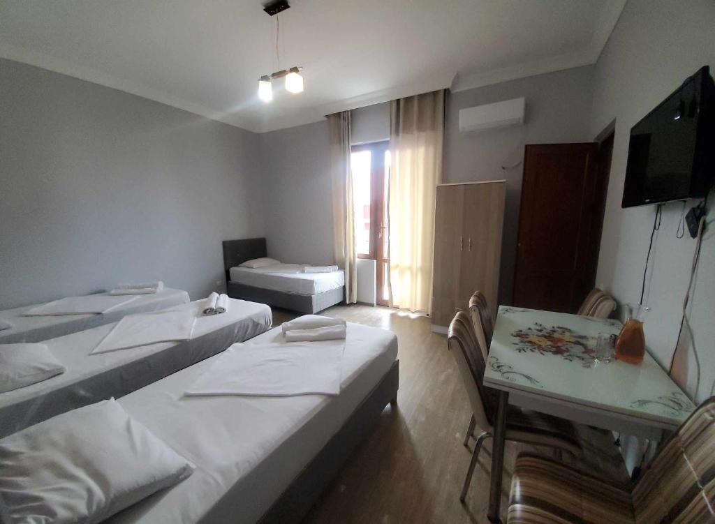 Rúm í herbergi á Elite Hotel Kobuleti