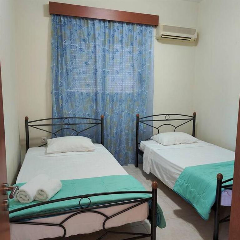 A bed or beds in a room at Bellavista House in Monolithos Rhodes