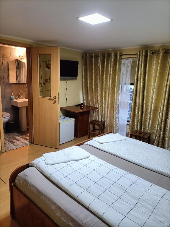 Postel nebo postele na pokoji v ubytování Casa Heidi