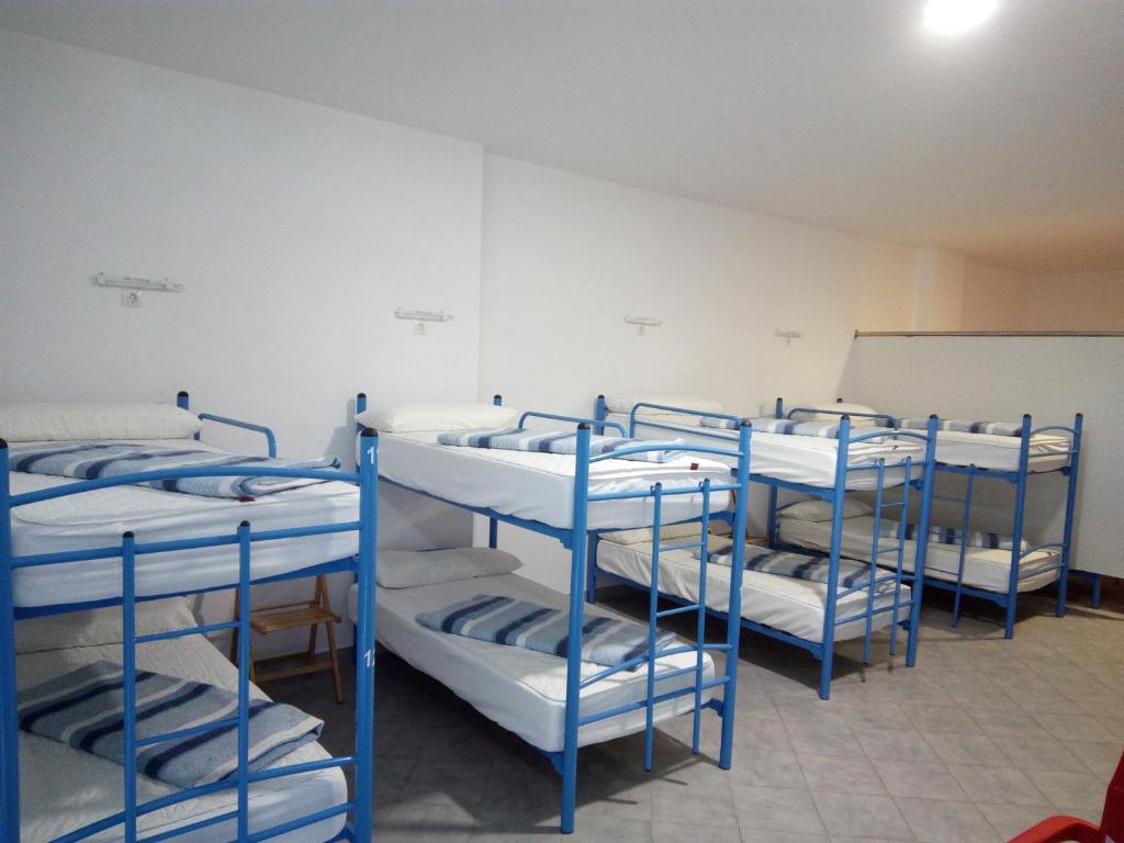 Postel nebo postele na pokoji v ubytování Albergue @ Muxia