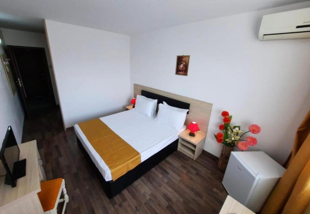 Postel nebo postele na pokoji v ubytování Hotel Apollo
