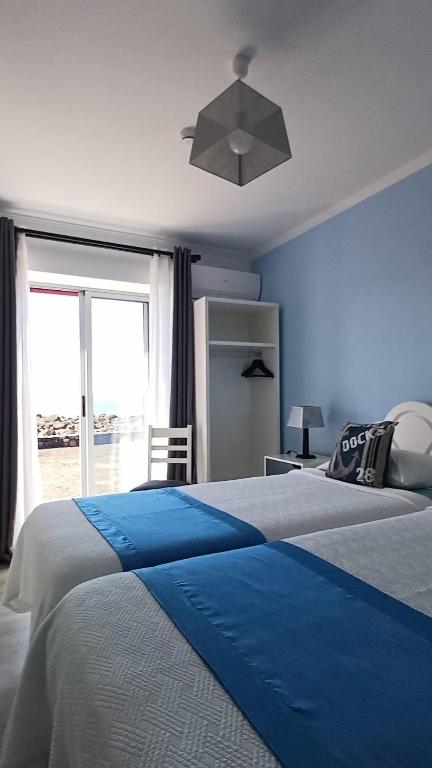 Postel nebo postele na pokoji v ubytování Ocean Breeze