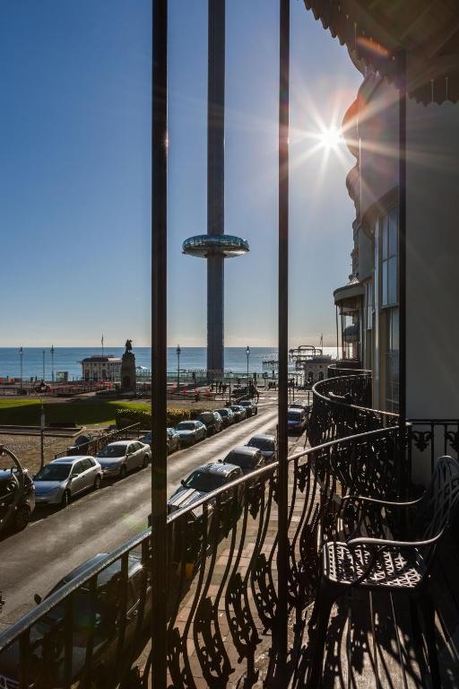 a balcony with a row of parked cars on the beach at Hotel Pelirocco in Brighton & Hove
