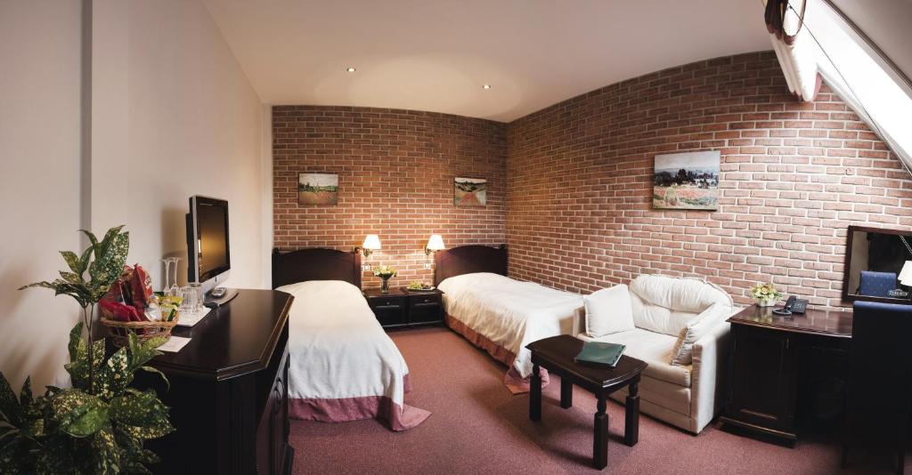 TV a/nebo společenská místnost v ubytování Hotel Purkmistr