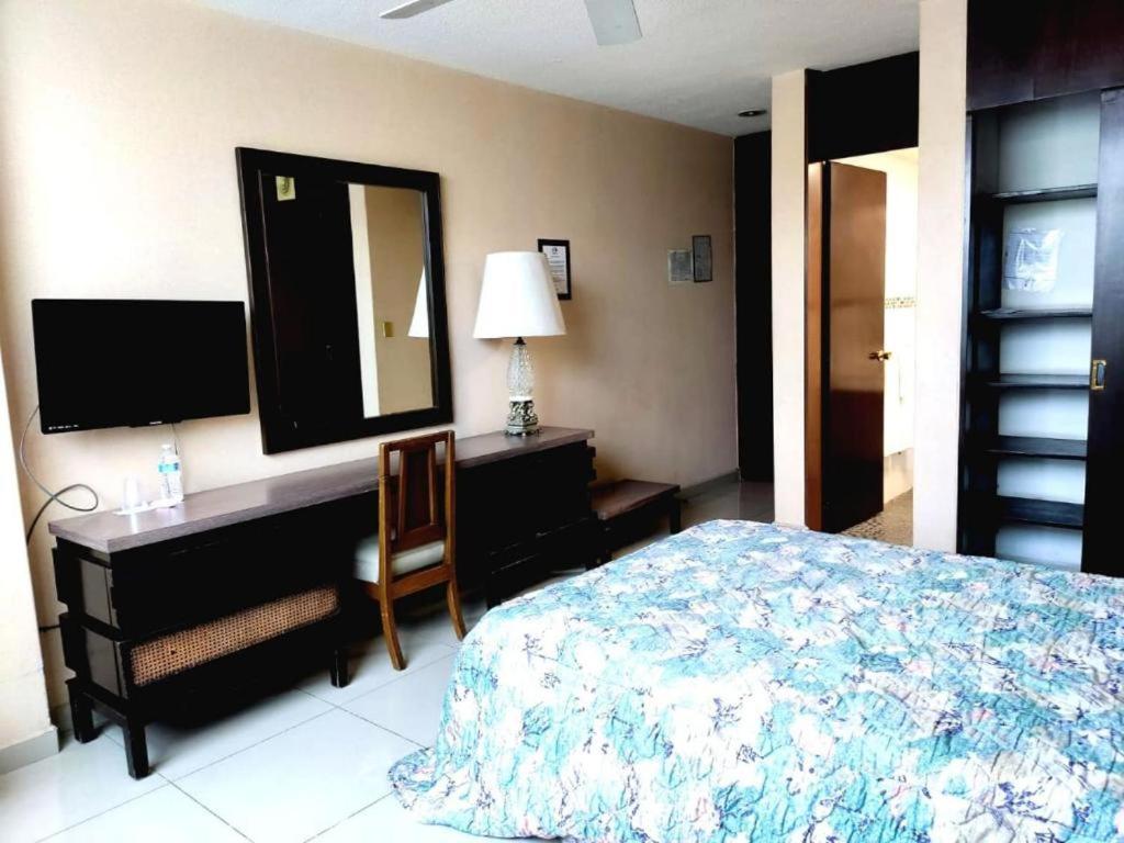 Postel nebo postele na pokoji v ubytování Hotel Mary Celaya