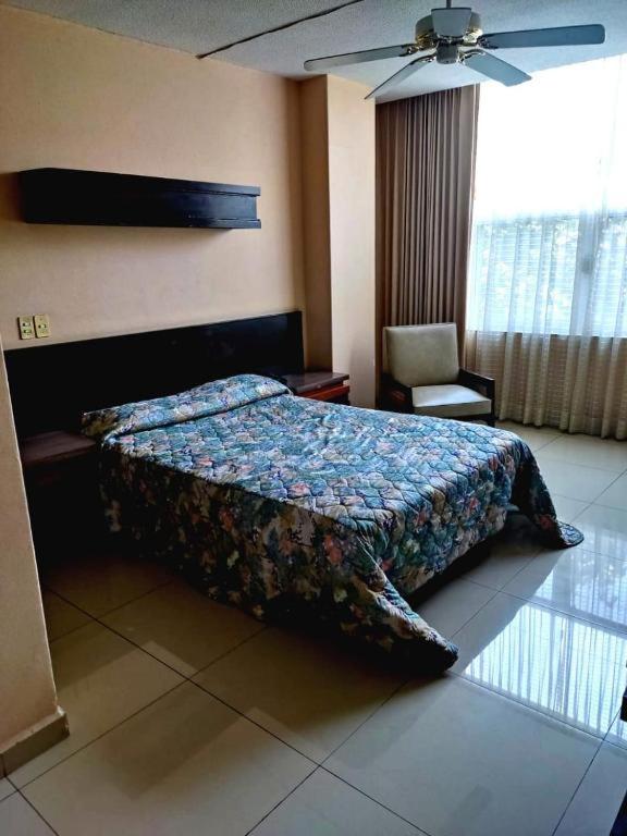 Postel nebo postele na pokoji v ubytování Hotel Mary Celaya
